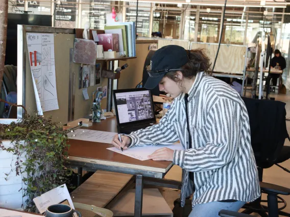 Girl at desk drawing