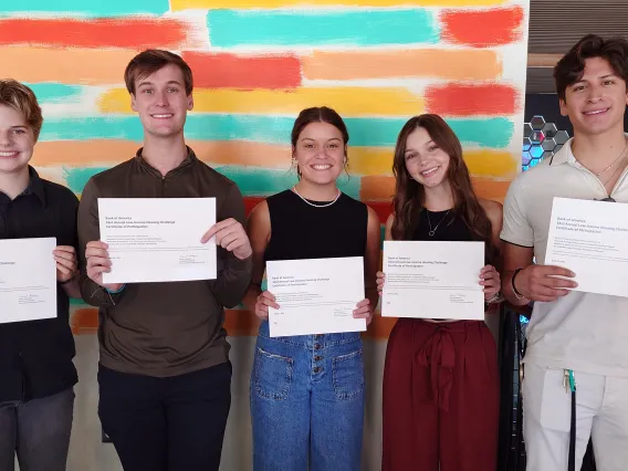 Students posing with their certificates. 