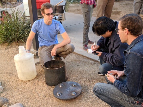 Students conduct a soil percolation test