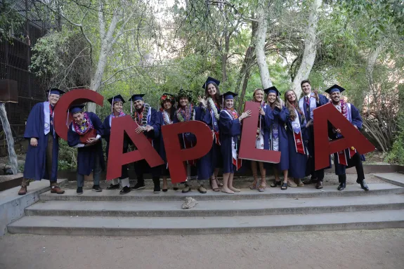 Group of Students Posing with Giant CAPLA Letters.