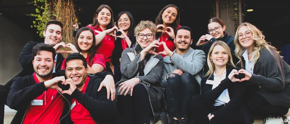 CAPLA Dean Nancy Pollock-Ellwand with students and hearts