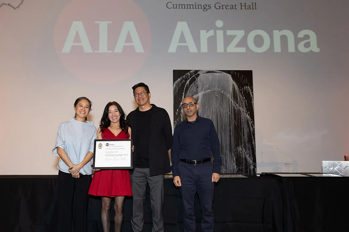 Teresa Rosano winning AIA Educator of the year award