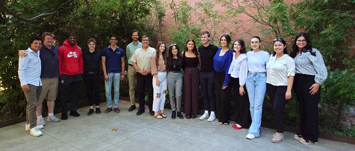 Group of students and faculty posing for a picture. 