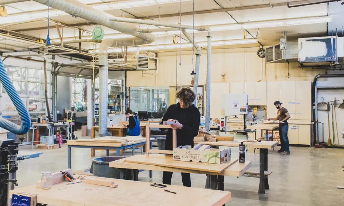 CAPLA students working with wood in the wood lab in the materials lab at the college of architecture, planning and landscape architecture