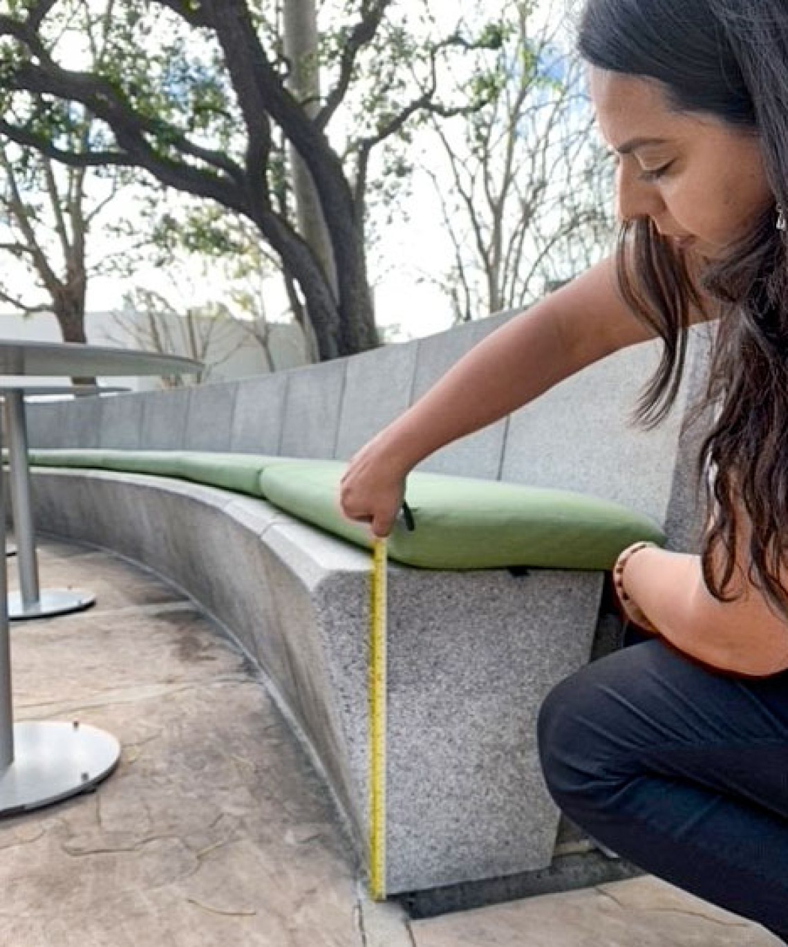 Irene Pineda measures a bench
