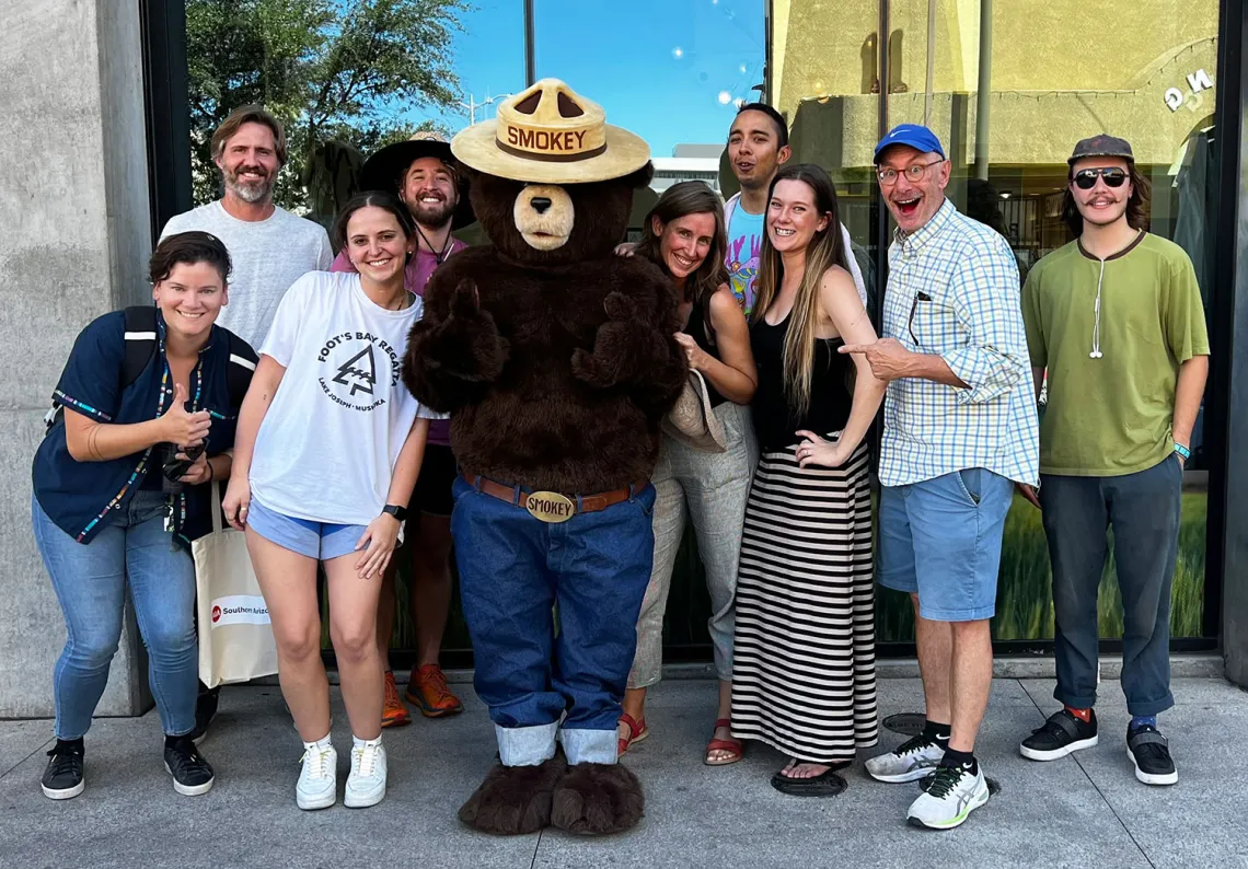 MLA students, Smokey Bear and others at Park(ing) Day 2022.